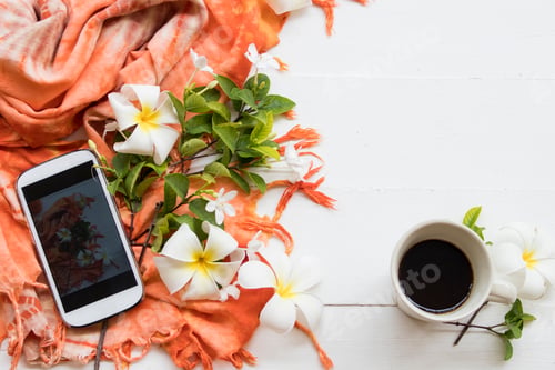 Preview: Colorful Orange Scarf With Frangipani White Flower Of Asia And Mobile Phone Lifestyle Woman Relax