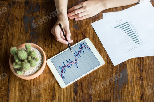 Preview: Young Business Woman Sitting For A Business Plan