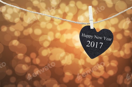 Preview: Black Heart Hung On Hemp Rope And Brown Abstract Bokeh Background,Concept Of The New Year 2017.