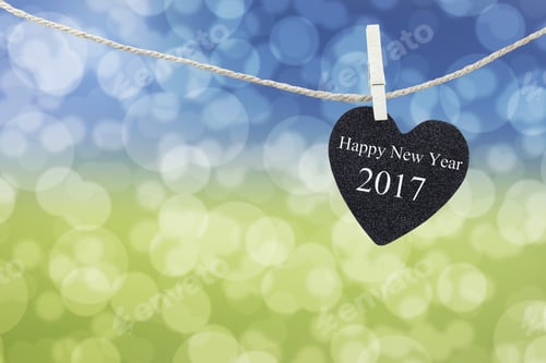 Preview: Black Heart Hung On Hemp Rope And Blue And Yellow Abstract Bokeh Background,Concept Of The New Year