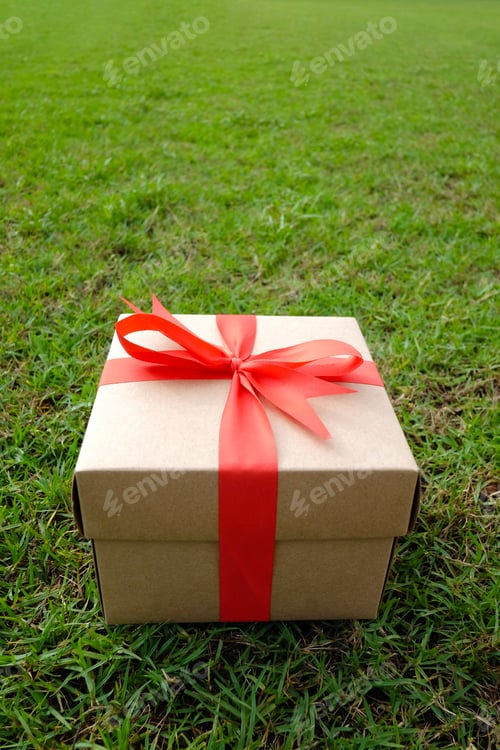 Preview: Brown Gift Box On The Green Lawn For Christmas, New Year, Valentine Day Or Anniversary Day And Have