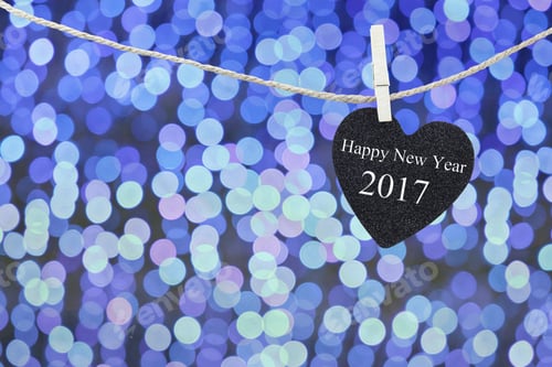 Preview: Black Heart Hung On Hemp Rope And Blue Abstract Bokeh Background,Concept Of The New Year 2017.