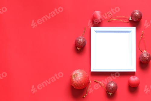 Preview: Empty Black Photo Frame And Christmas Decoration On Red Background For Design In Your Work Concept.