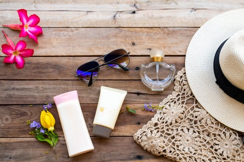 Preview: Sunscreen Spf50, Body Lotion, Perfume, Sunglasses, Hat And Knitting Of Lifestyle Woman Relax