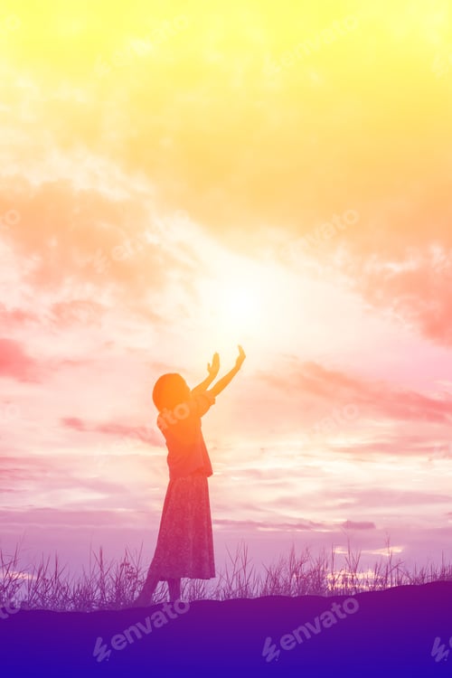 Preview: Silhouette Of Woman Praying Over Beautiful Sky Background