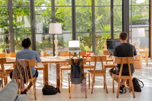 Preview: Tourist Men Working On Laptop Computer In Coffee Shop.