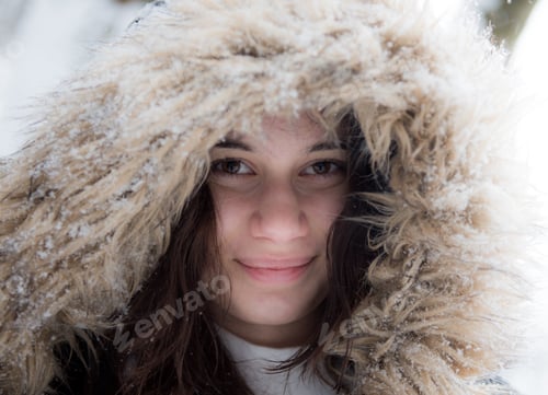 Preview: A Closeup Of A Happy European Young Female Wearing A Hat Captured In Winter On A Snowy Day