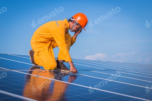 Engineer Or Electrician Working On Replacement Solar Panel At Solar Power Plant; Working On Repair
