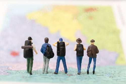 Preview: Miniature People Backpacker Walking On Map Travel And Adventure Concepts.