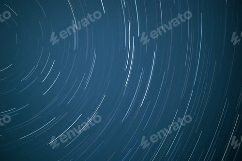 Preview: A Horizontal Background Of Star Trails On A Bright Blue Sky