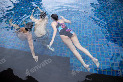 Preview: Group Of Friends Taking Selfie Under The Water In Swimming Pool Resort With Waterproof Cell Phone