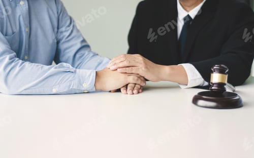 Preview: Justice And Law Concept. Consultant Holding Client Hands In Law Firm.
