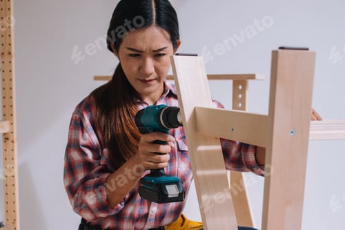 Preview: Woman Worker In The Carpenter Workroom; Delivery Service Furniture Store And Assembling For Buyer.