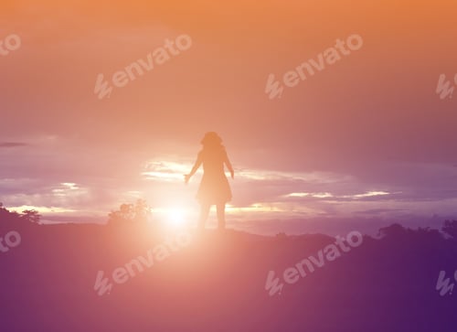 Preview: Silhouette Of Woman Praying Over Beautiful Sky Background