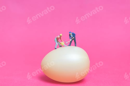 Preview: Miniature People Work At Easter-Eggs For Easter Day On Pink Background
