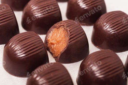 Preview: A Selective Focus Shot Of Chocolate Bars With Marmalade On A White Surface