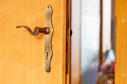 Preview: A Closeup Shot Of An Open Door With A Vintage Handle