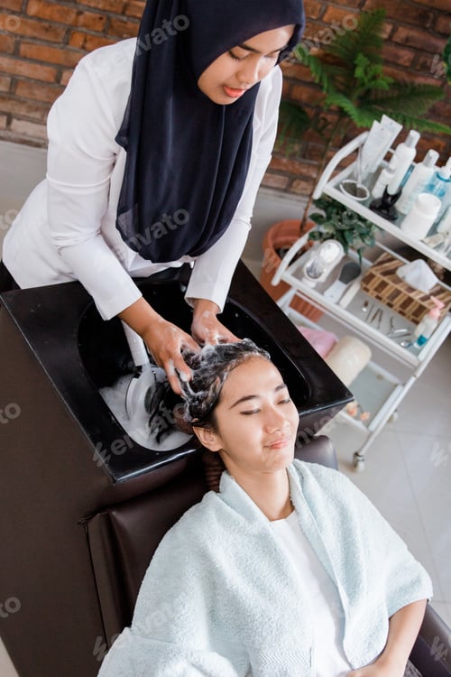 Preview: Woman Receiving Relaxing Shampoo at Hair Salon