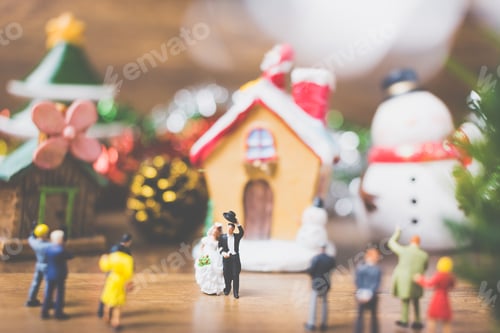 Preview: Miniature People In The Village Celebrate Christmas Day , Holiday Concept.