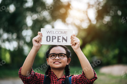 Preview: Girl Holding An Open Sign