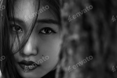 Preview: Asian Women Face On A Black Background.The Expressions On The Faces Of Women.Black And White