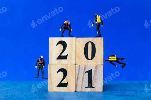 Preview: Miniature People Divers Diving Around Wooden Block 2021 , Happy New Year Concept