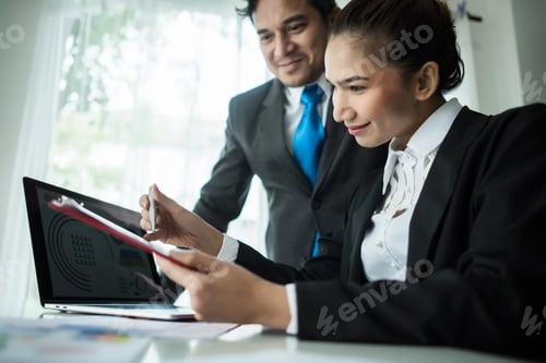 Preview: Close Up Of Business People Working With Business Document During Discussion At Meeting.