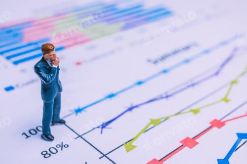 Preview: Miniature People : Businessman Standing On A Paper Graph Chart ,Developing A Teamwork Concept