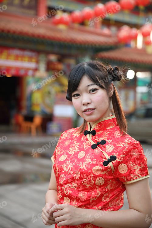Preview: Beauty Woman Wear Red Cheongsam Looking And Smile In Chinese New Year
