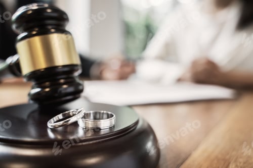 Preview: Judge Gavel With Pair Of Marriage Ring, Divorce Concept.