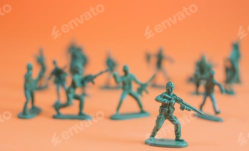 Preview: Closeup Of Action Mini Toy Soldier On Orange Background