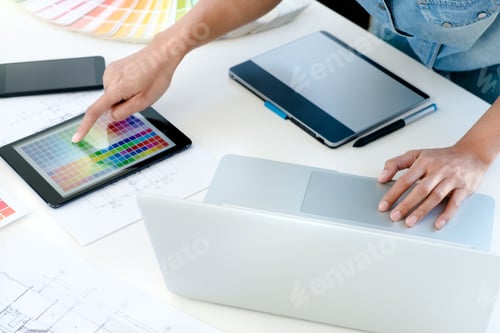 Preview: Interior Aechitect Designer At Work On Project Of Building With Colour Chart