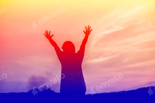 Preview: Silhouette Of Woman Praying Over Beautiful Sky Background