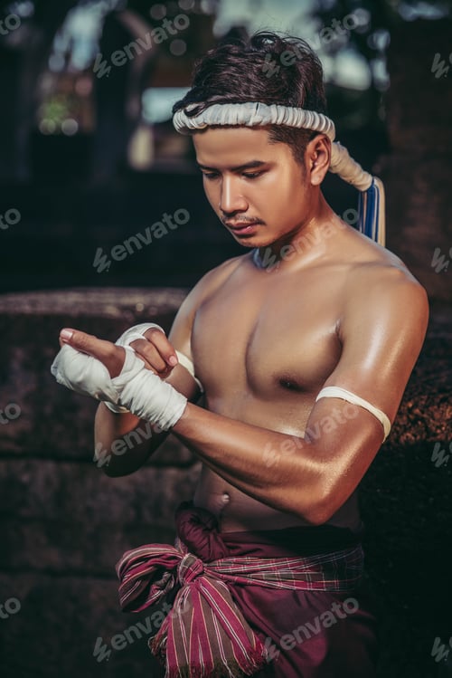 Preview: The Boxer Sat On The Stone, Tied The Tape Around His Hand, Preparing To Fight.