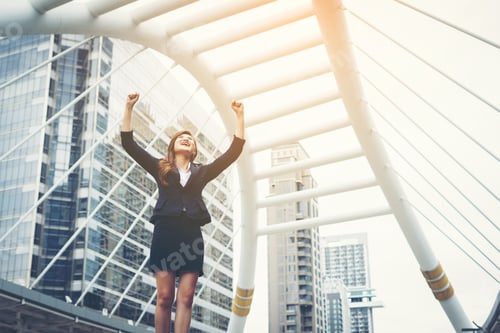 Preview: Happy Success Businesswoman Overlooking Into The City Center Hands Raised.