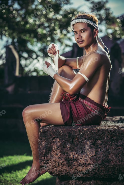 Preview: The Boxer Sat On The Stone, Tied The Tape Around His Hand, Preparing To Fight.