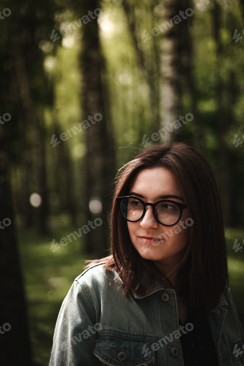 Preview: A Shallow Focus Of A Beautiful Young Brunette Ukrainian Female Wearing Glasses In The Woods