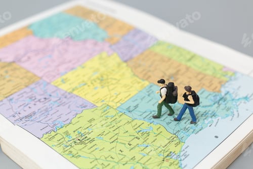 Preview: Miniature People Backpacker Walking On Map Travel And Adventure Concepts.
