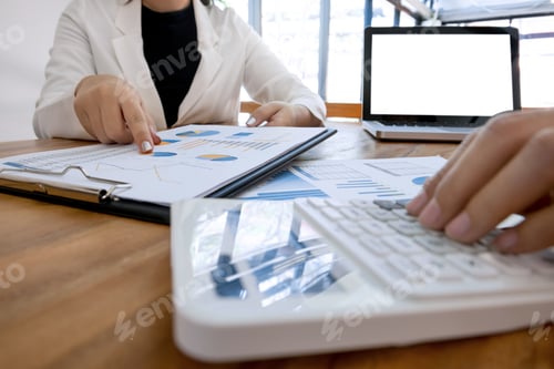 Preview: Executive Analysis On Data Paper And Accountant Using Calculator At The Office With Blank Screen