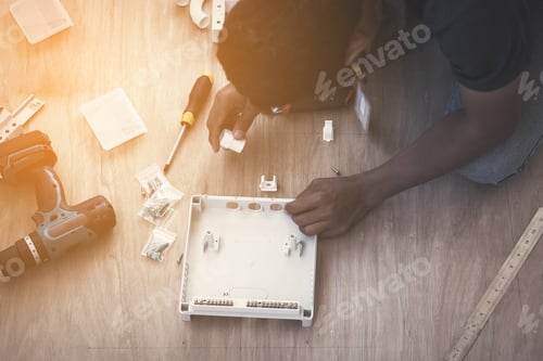 Preview: Electrician Working On Design And Installing Circuit Breakers