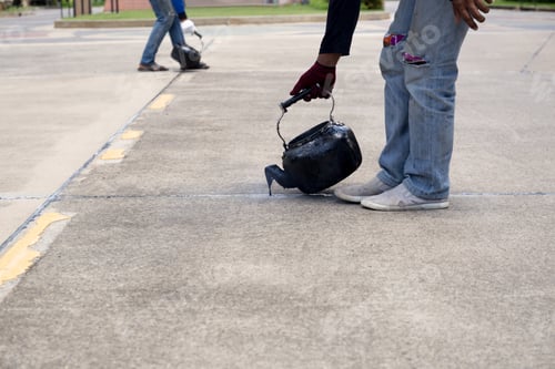 Preview: Worker Is Pouring Asphalt For Road Repair In Day Time