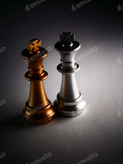 Preview: A Vertical Closeup Shot Of Silver And Gold King Chess Pieces