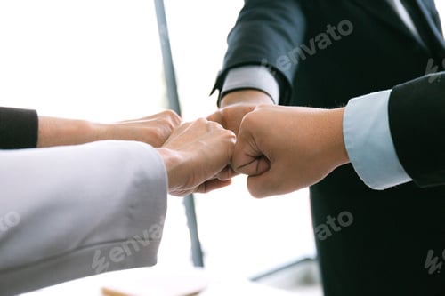 Preview: Business Team Stacking Hands