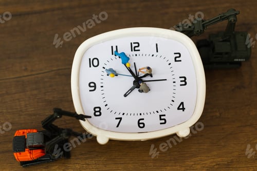Preview: Miniature People : The Team Is Working On An Alarm Clocks , Working Time Concept