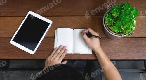Preview: Business Man Hand Using Laptop And Write Note Inspire Idea On Wood Desk, Startup Concept. Top View.