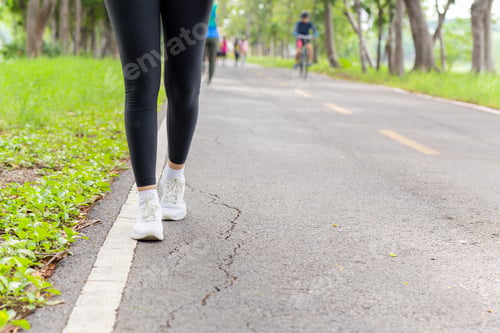 Preview: Fitness Woman Legs Exercise Walking On Park Trail In The Morning.