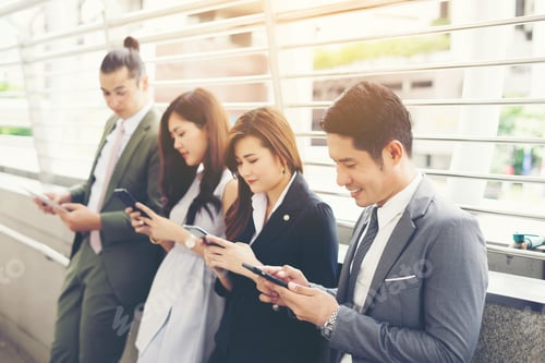 Preview: Business People Using Smartphone While Together