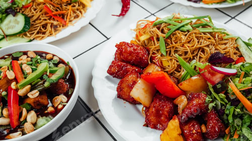 Preview: A Variety Of Food Including Noodles, Spicy Chicken Wings, Soup And Vegetables On A Table