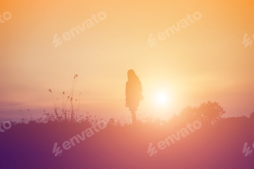 Preview: Silhouette Of Woman Praying Over Beautiful Sky Background