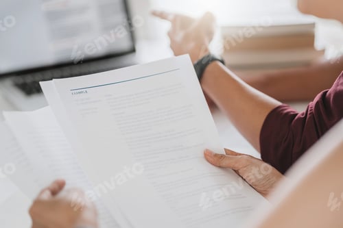 Preview: University Students Sitting On The Table Brainstorming Projects Working In Library.